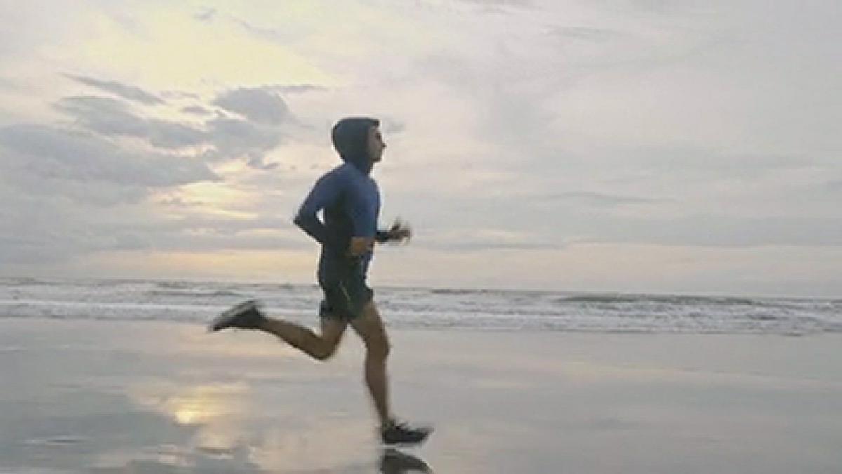 'Video thumbnail for A Man Running On The Beach Shore · Free Stock Video'