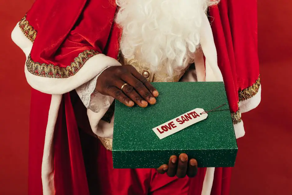An image of Santa Claus holding a bag full of gifts, smiling with cheer