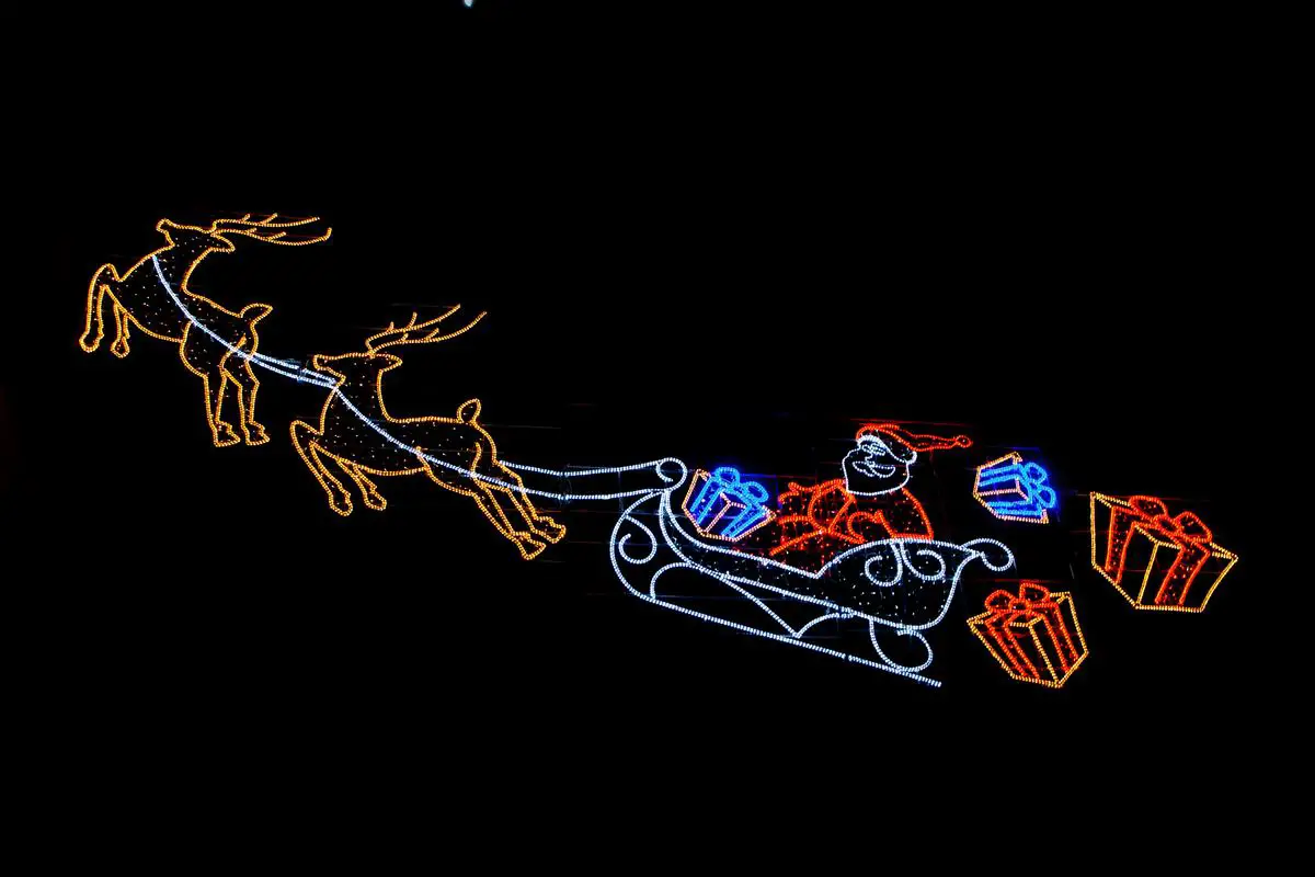 Illustration of a person riding a one-horse open sleigh through the snow with jingling bells, representing the joyful experience described in 'Jingle Bells'.
